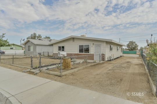 420 West Upjohn Avenue Ridgecrest, CA 93555 - Photo 3 of 32 a view of a house with a backyard