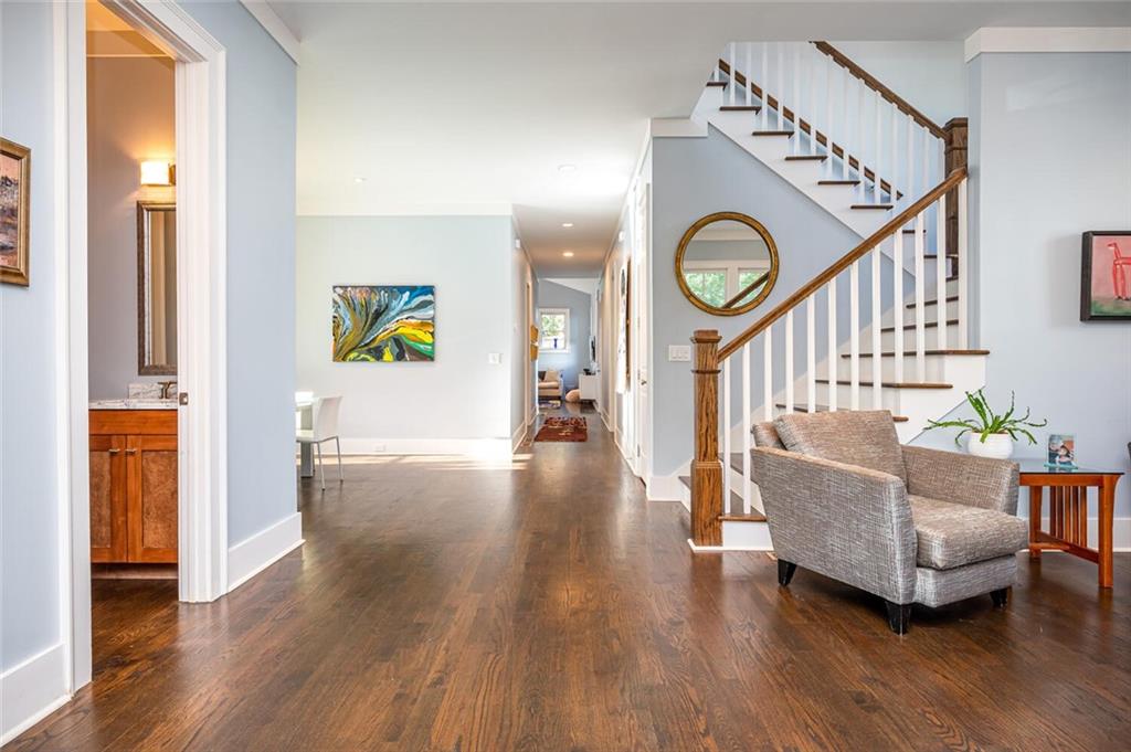 123 Ansley Street Decatur, GA 30030 - Photo 35 of 61 a living room with furniture and a wooden floor