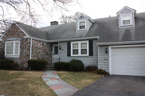 65 Westvale Road Milton, MA 02186 - Photo 1 of 20 a view of a brick house with many windows
