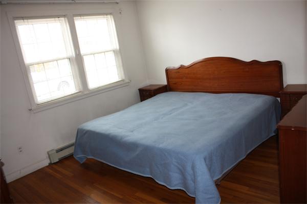 65 Westvale Road Milton, MA 02186 - Photo 13 of 20 a bedroom with a bed and a window