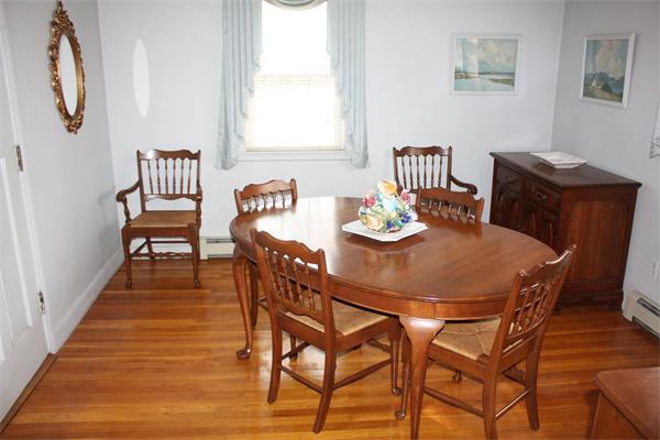 65 Westvale Road Milton, MA 02186 - Photo 8 of 20 a dining room with furniture and wooden floor