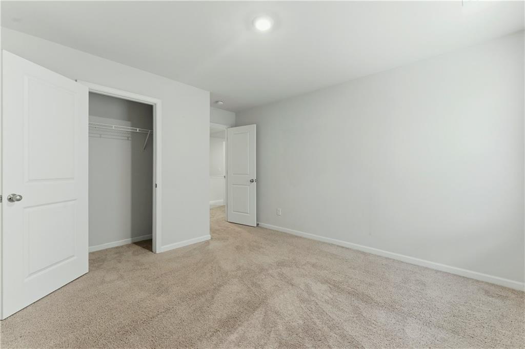 7492 Knoll Hollow Road Lithonia, GA 30058 - Photo 24 of 30 an empty room with an entryway