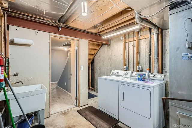 a view of a deck with two chair and wooden floor