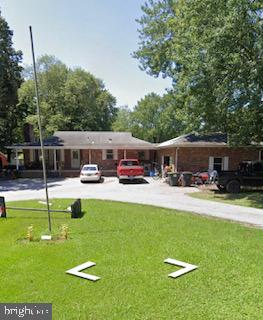 25911 River Road Newcomb, MD 21653 - Photo 2 of 2 Street view prior to clean up