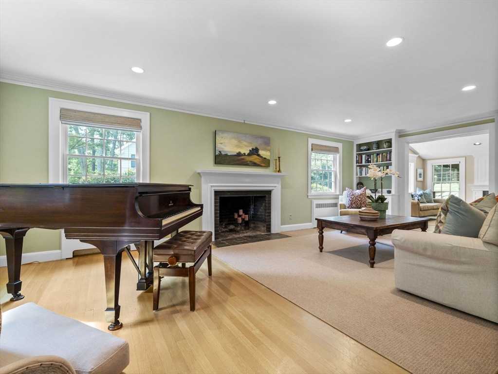33 Thackeray Road Wellesley, MA 02481 - Photo 4 of 20 a living room with furniture and a fireplace