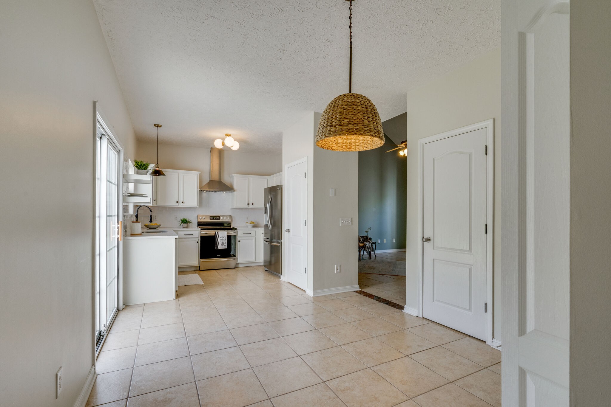 306 Cherry Drive Franklin, TN 37064 - Photo 13 of 30 a view of a kitchen with a sink and dishwasher a refrigerator with white cabinets