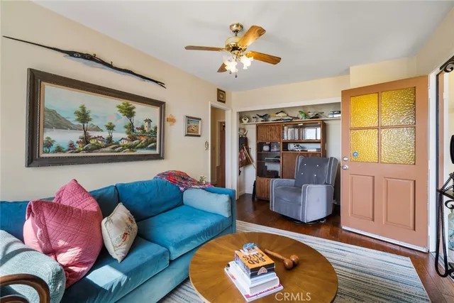 a bedroom with bed couch and window
