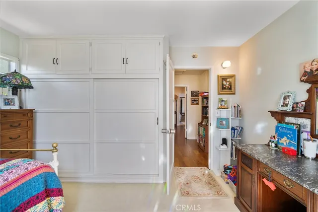 a view of a workspace with furniture and wooden floor