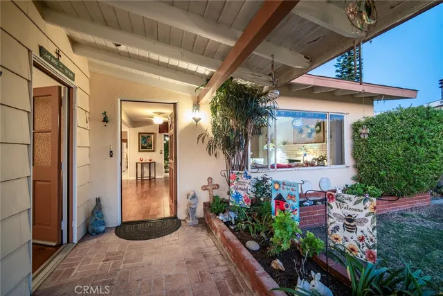 a view of a front door and potted plant