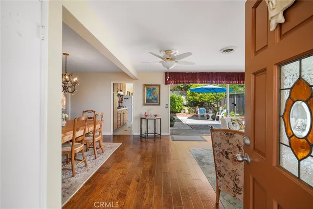 a living room with furniture fireplace and a large window
