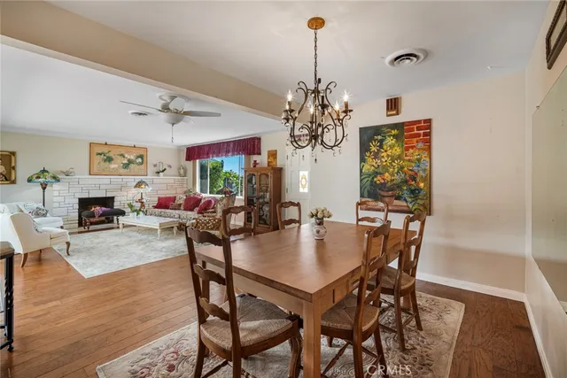 a living room with furniture large window and a fireplace