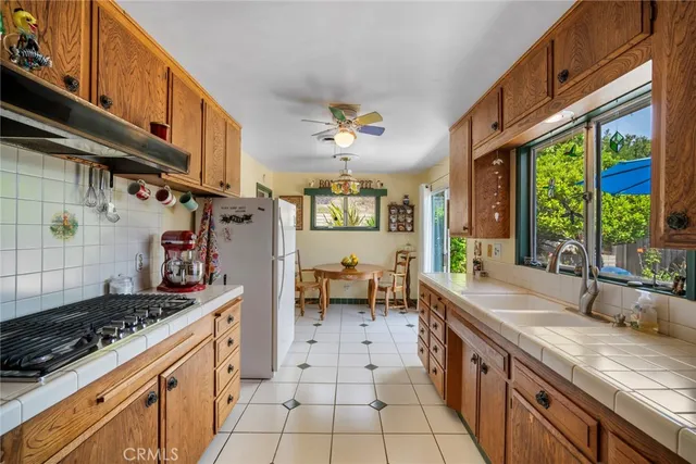 a view of a dining room with furniture and a window
