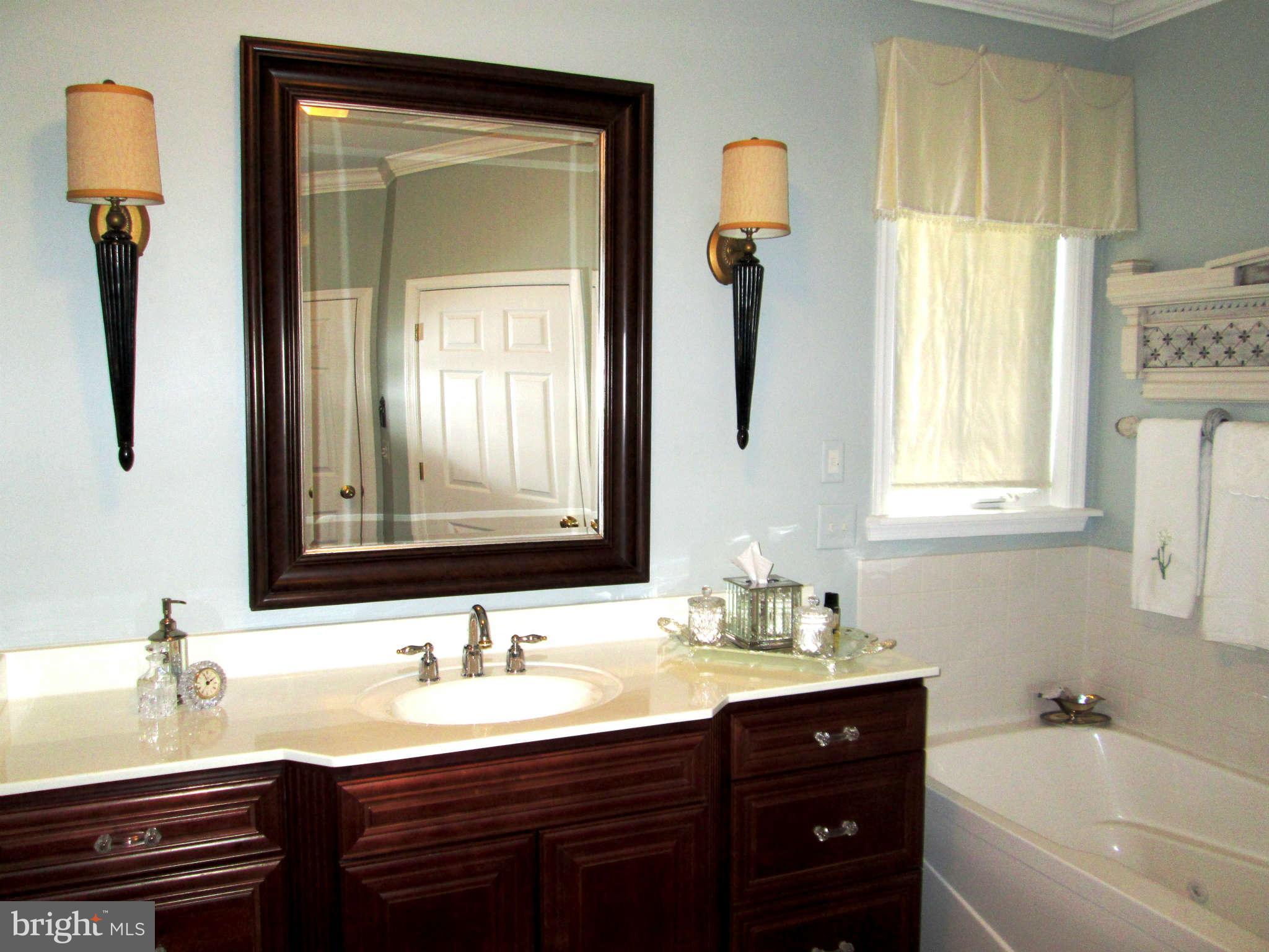 2985 Kabletown Road Charles Town, WV 25414 - Photo 14 of 22 a bathroom with a granite countertop sink and a mirror