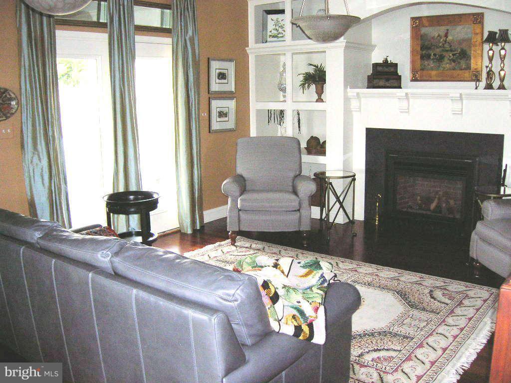 2985 Kabletown Road Charles Town, WV 25414 - Photo 18 of 22 a living room with furniture and a fireplace