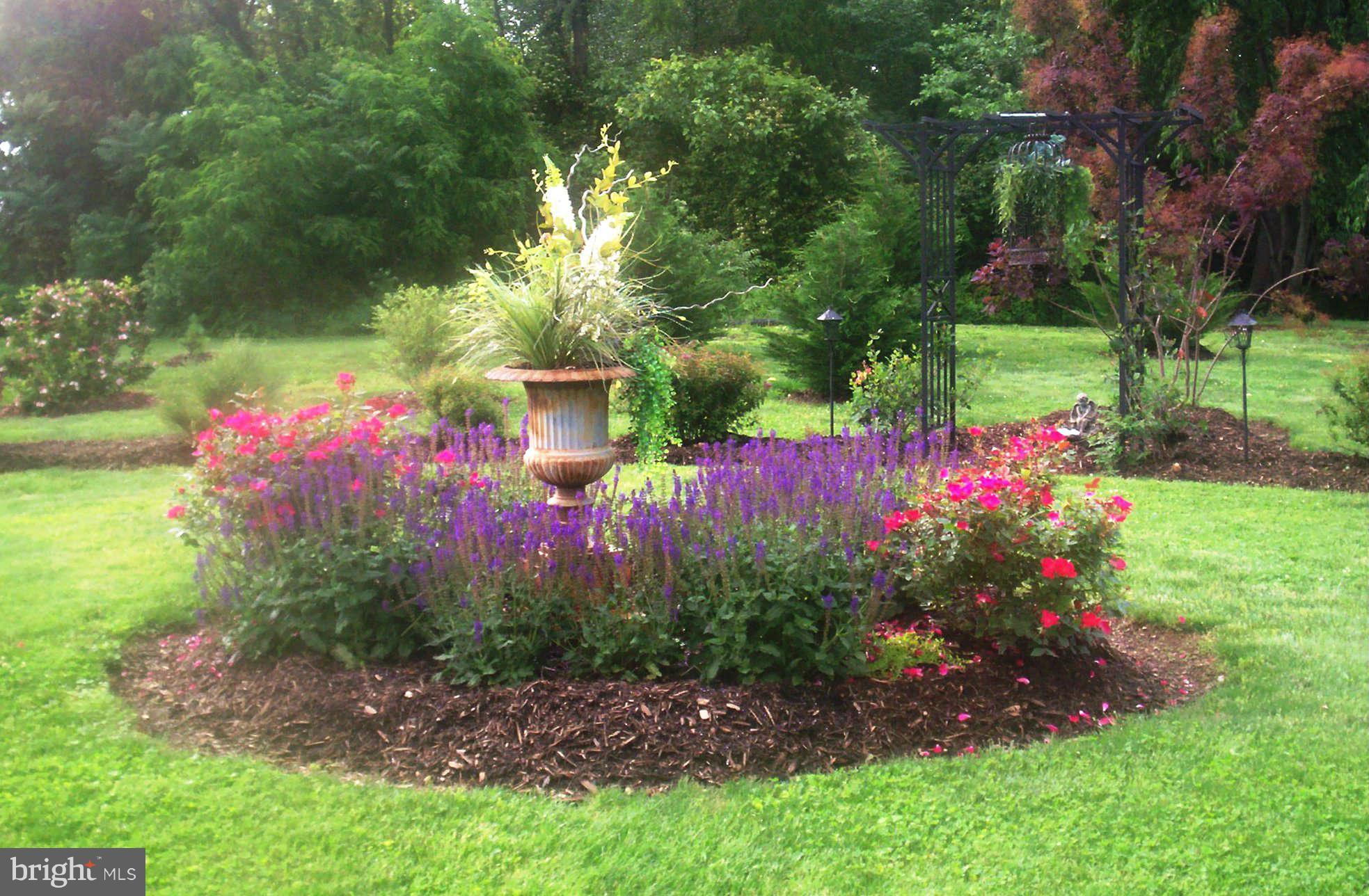 2985 Kabletown Road Charles Town, WV 25414 - Photo 3 of 22 a view of a garden with flowers