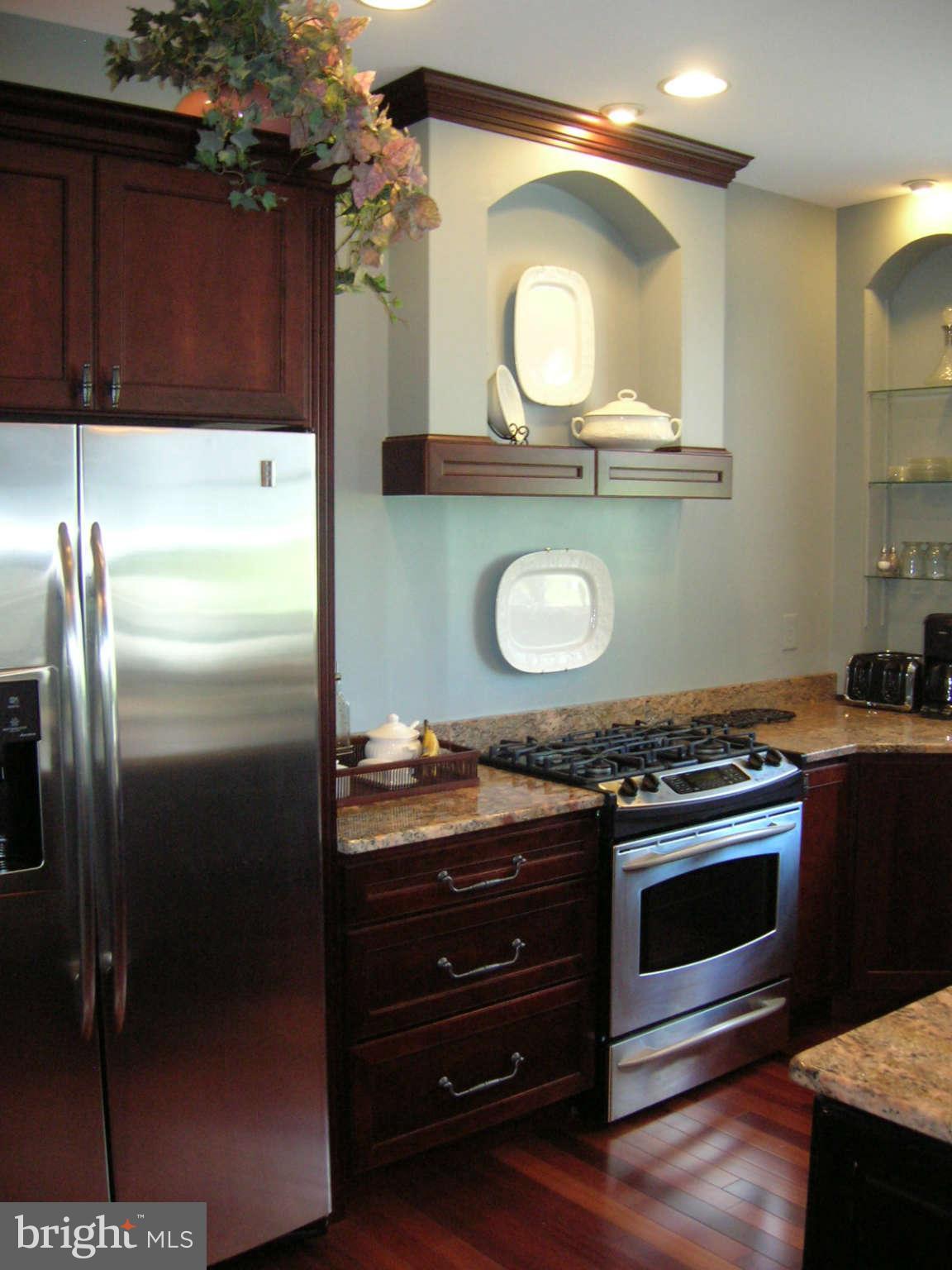 2985 Kabletown Road Charles Town, WV 25414 - Photo 4 of 22 a stove top oven sitting inside of a kitchen