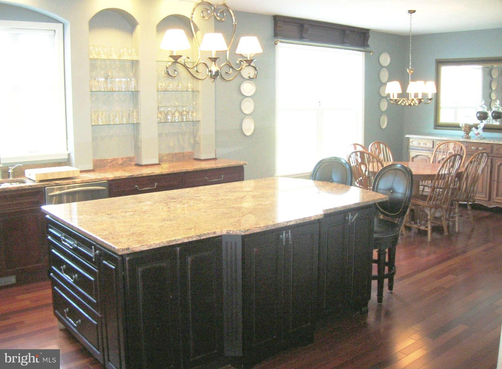 2985 Kabletown Road Charles Town, WV 25414 - Photo 7 of 22 a kitchen with a table and chairs