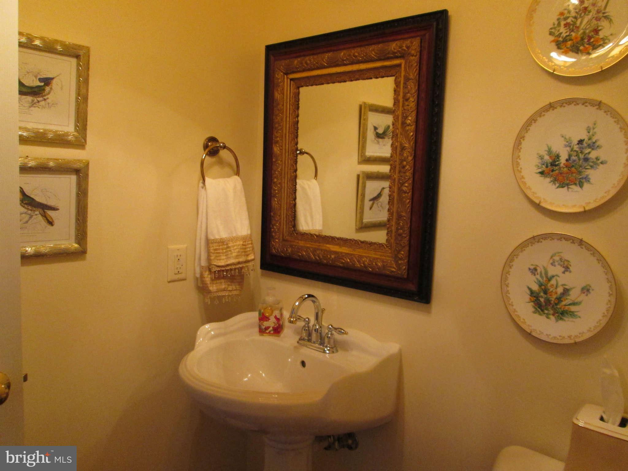 2985 Kabletown Road Charles Town, WV 25414 - Photo 10 of 22 a bathroom with a toilet sink and mirror
