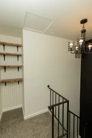 a view of a hallway with seating area