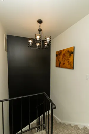 a view of a hallway with paintings on the wall