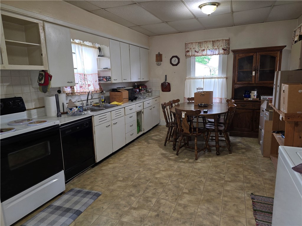 457 Wolf Road West Alexandria, OH 45381 - Photo 12 of 28 This spacious kitchen offers ample cabinetry and an inviting dining area, perfect for everyday meals.