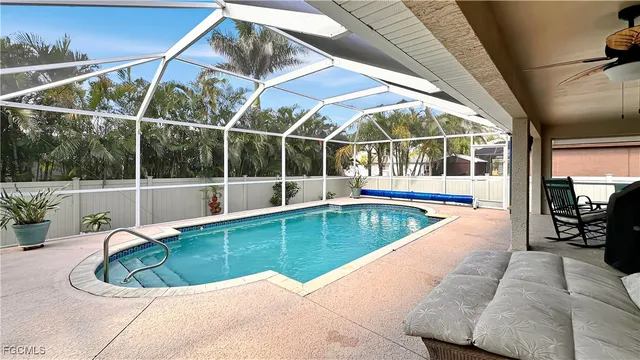 a view of a swimming pool with a patio