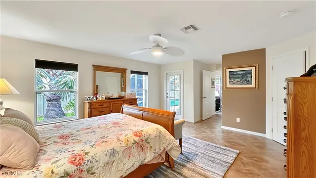 a bedroom with furniture and windows