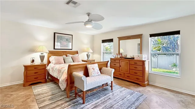 a living room with furniture and a dresser