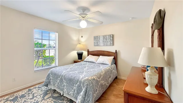 a bedroom with a bed and a potted plant