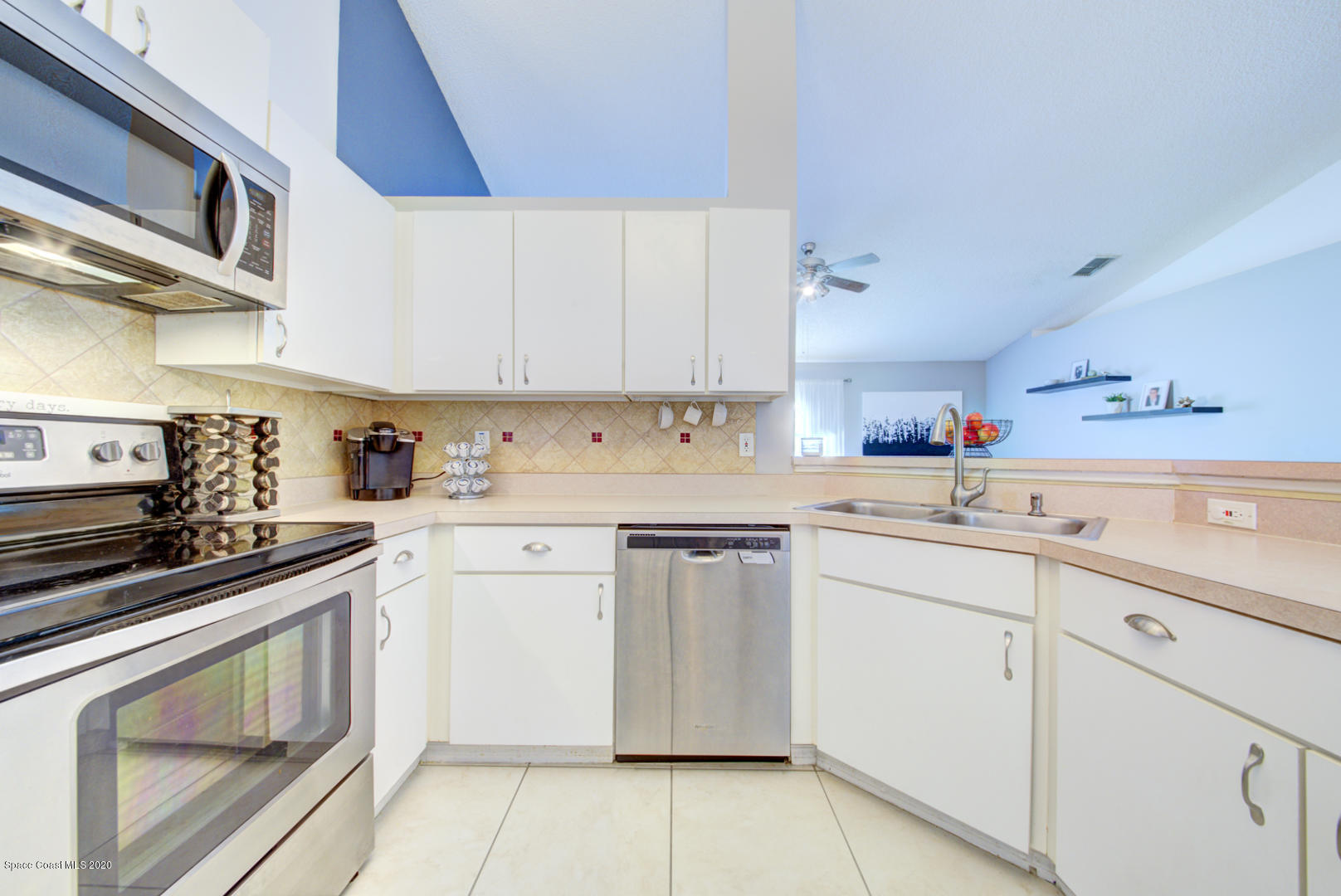 2380 High Ridge Road Palm Shores, FL 32935 - Photo 18 of 58 kitchen with tile backsplash