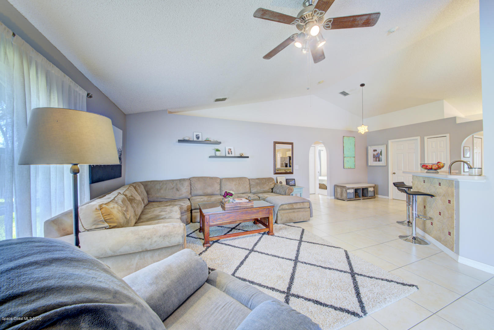 2380 High Ridge Road Palm Shores, FL 32935 - Photo 26 of 58 family room with vaulted ceiling