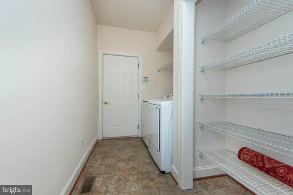 a bedroom with a bed lamp and window