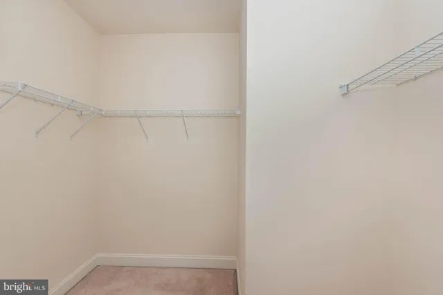 a spacious bathroom with a tub sink and mirror