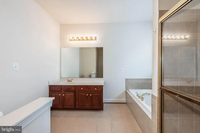a bathroom with a tub and a window