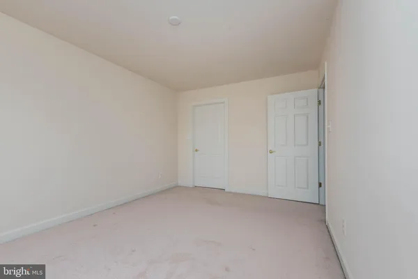 a view of a room with wooden walls