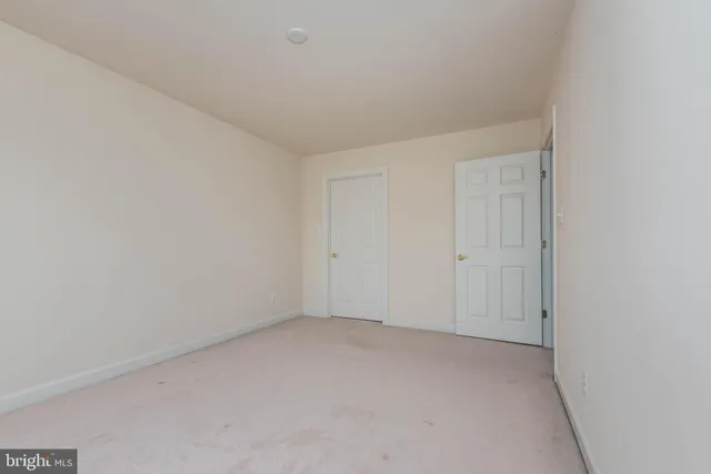 a view of a room with wooden walls