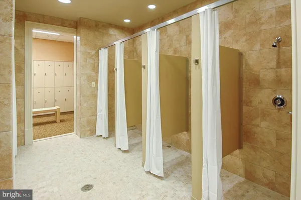 a room with gym equipment and windows