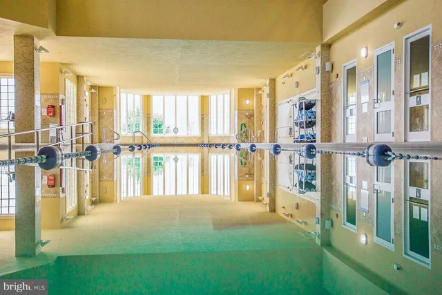 a view of a swimming pool with a lounge chairs