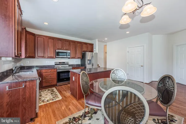 a view of dining room and wooden floor