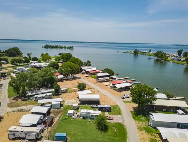 an aerial view of a house with a lake view