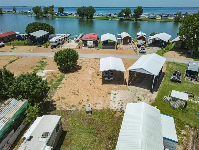 a view of a lake with couches and wooden floor