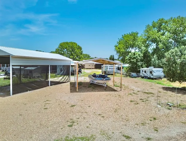 a view of a house with backyard porch and sitting area