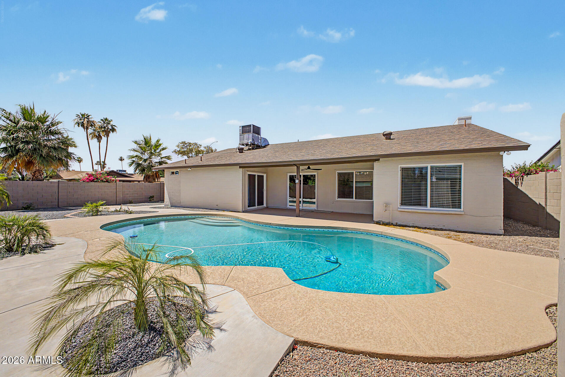 1009 West Pampa Avenue Mesa, AZ 85210 - Photo 28 of 31 a view of a house with a swimming pool
