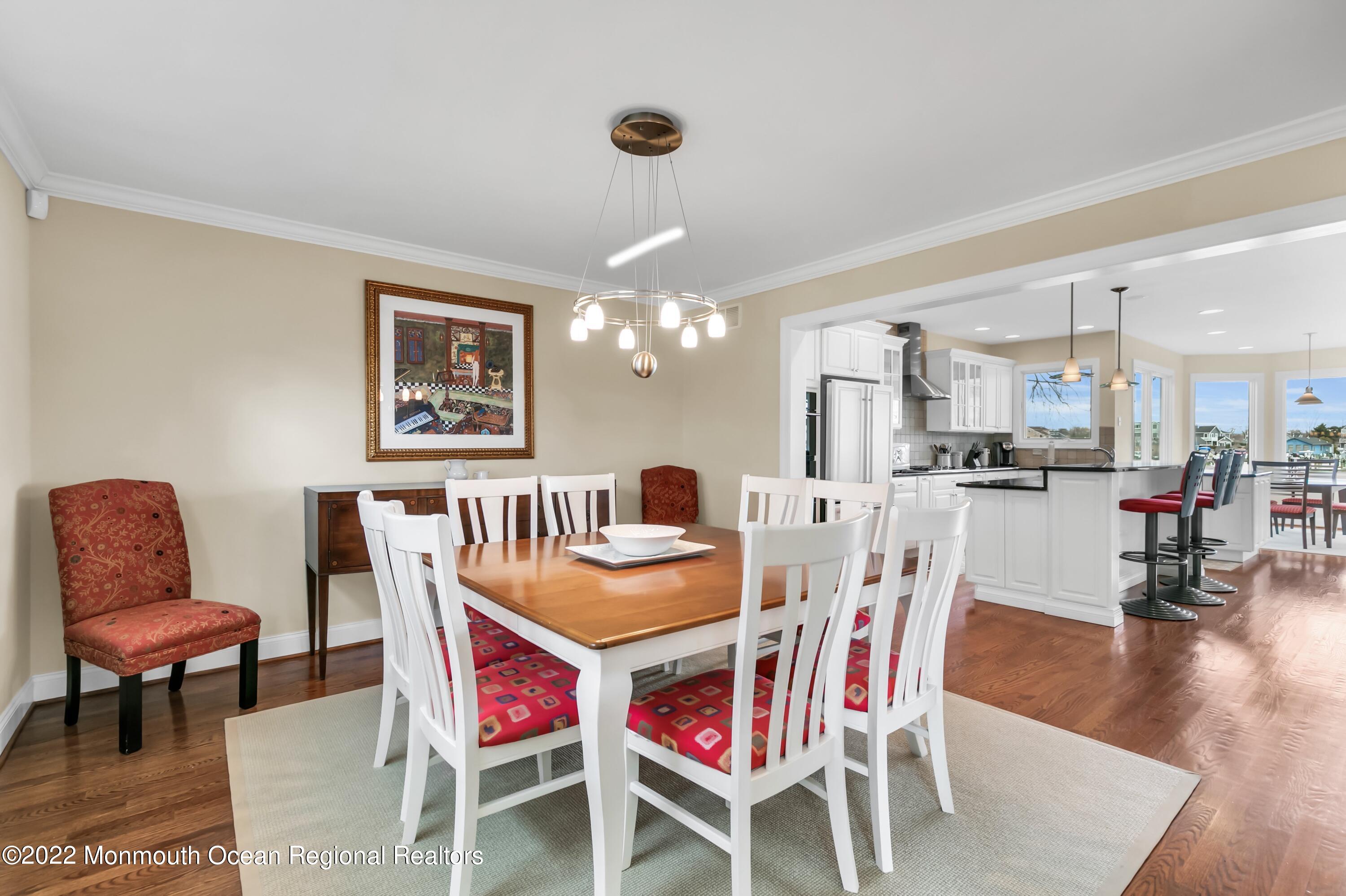 574 Harbor Road Brick, NJ 08724 - Photo 21 of 65 a dining room with furniture and wooden floor