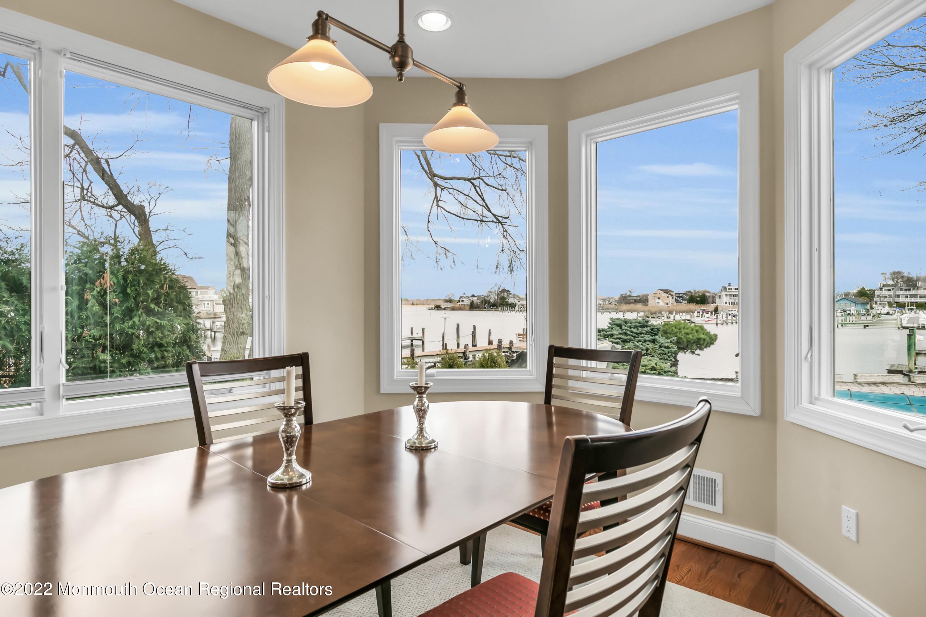574 Harbor Road Brick, NJ 08724 - Photo 26 of 65 a view of a dining room with furniture window and wooden floor