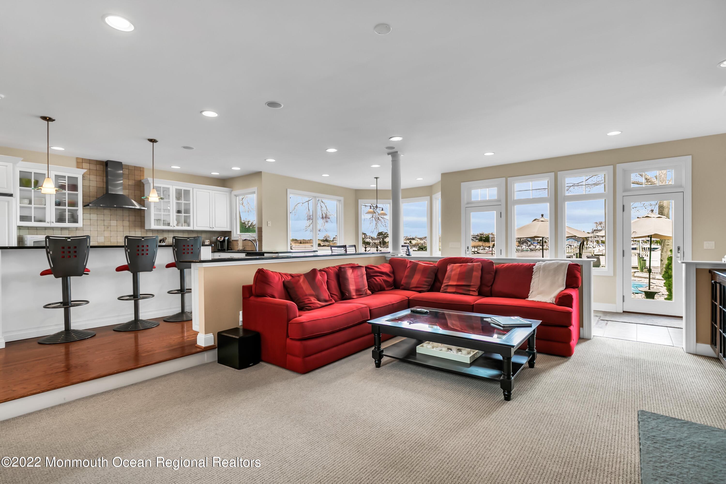 574 Harbor Road Brick, NJ 08724 - Photo 27 of 65 a living room with furniture kitchen view and a large window