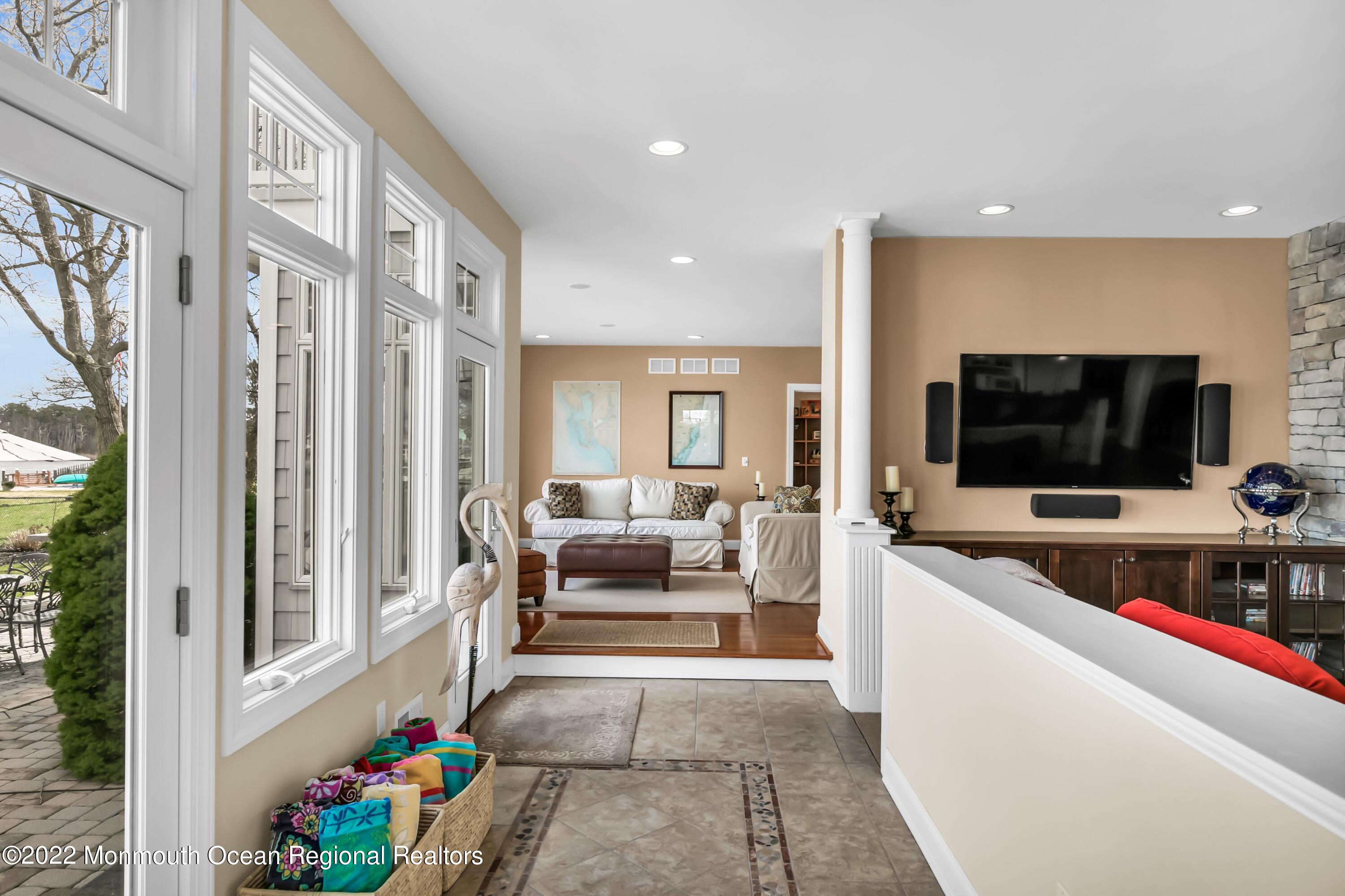 574 Harbor Road Brick, NJ 08724 - Photo 32 of 65 a living room with furniture and a flat screen tv