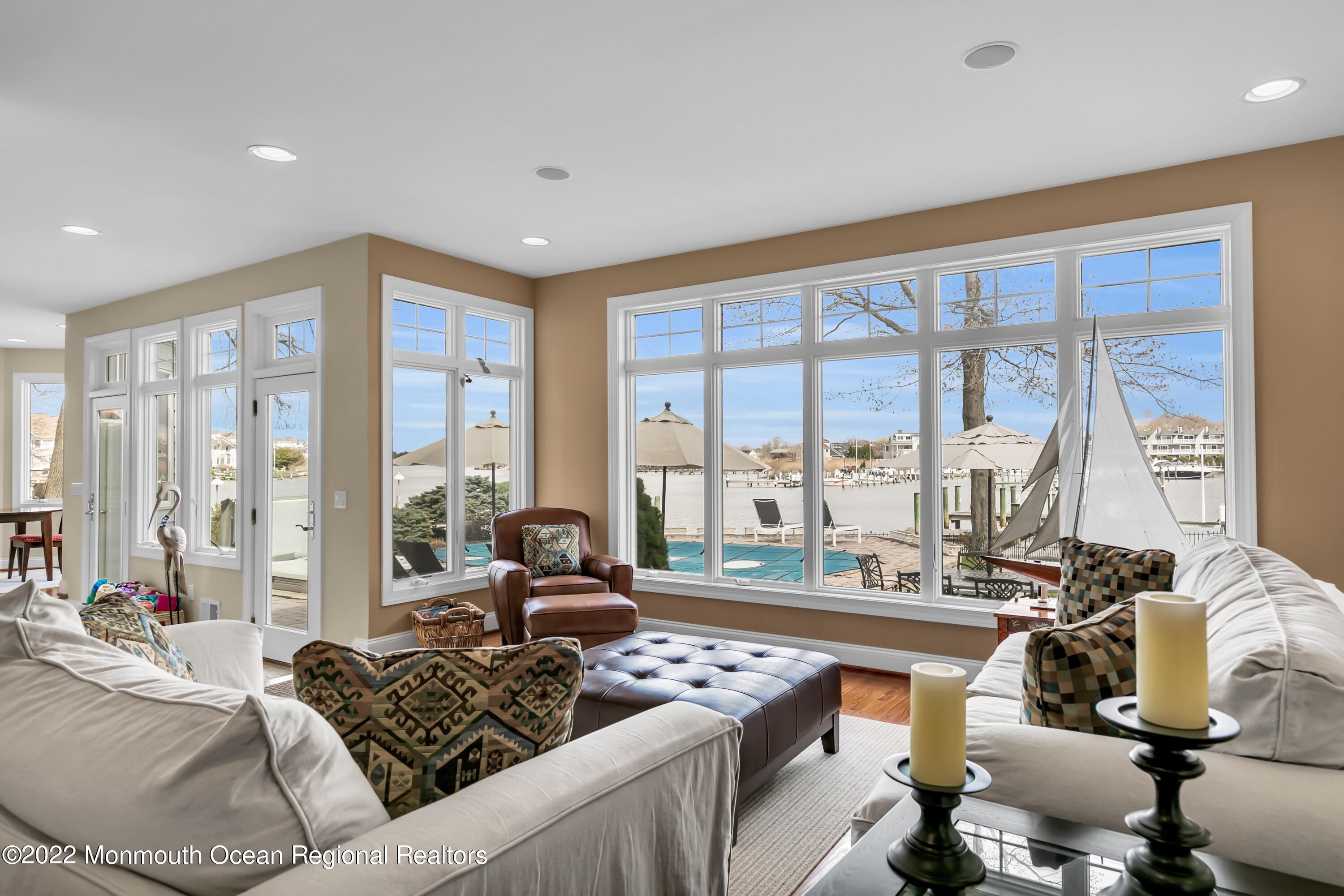 574 Harbor Road Brick, NJ 08724 - Photo 34 of 65 a living room with furniture and floor to ceiling windows