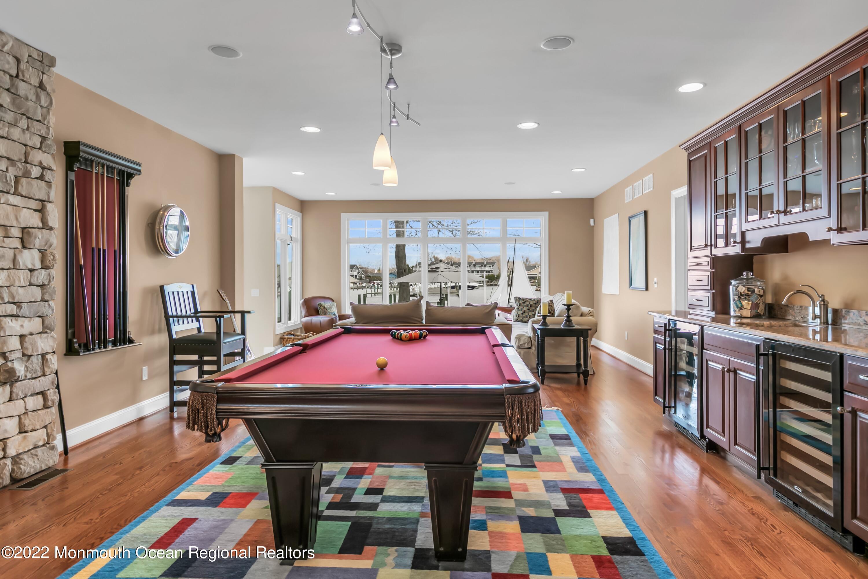 574 Harbor Road Brick, NJ 08724 - Photo 36 of 65 a room with furniture a rug and a flat screen tv