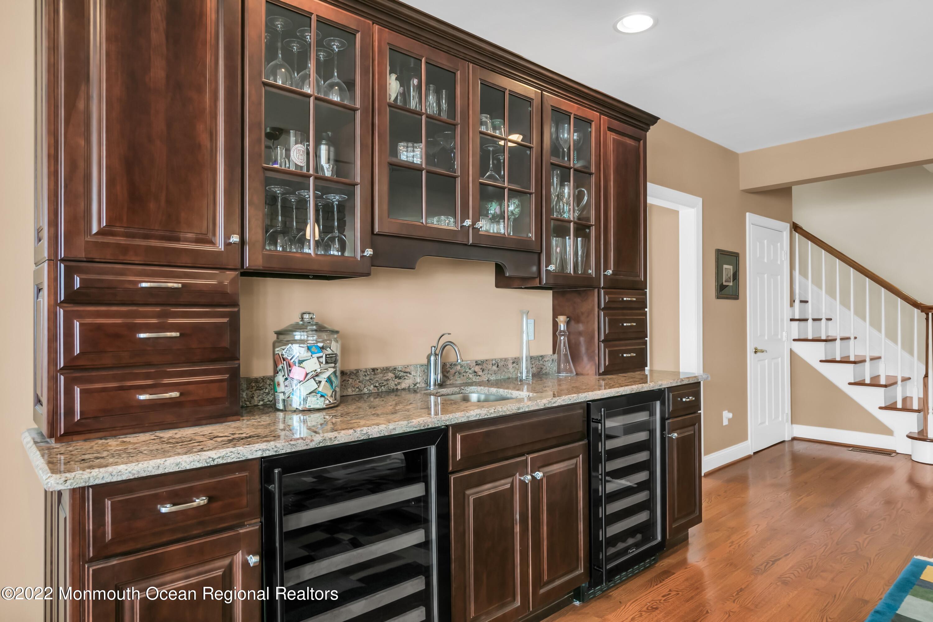 574 Harbor Road Brick, NJ 08724 - Photo 37 of 65 a kitchen with stainless steel appliances granite countertop a sink and cabinets
